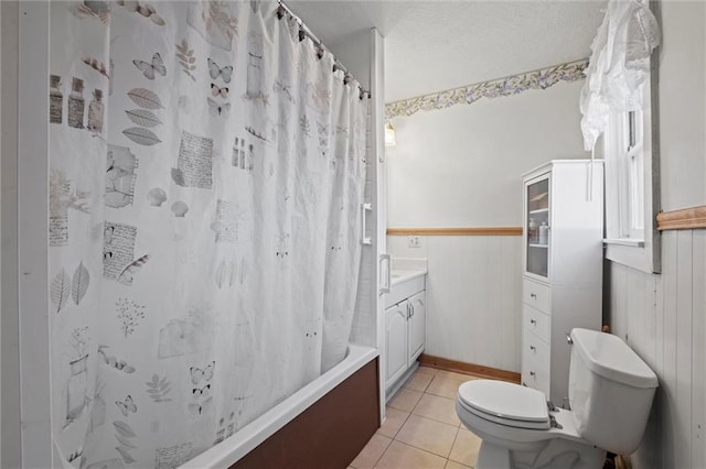 27977 W 311th St, Paola, KS 66071 - full bath with toilet, a wainscoted wall, tile patterned flooring, shower / bath combo, and vanity