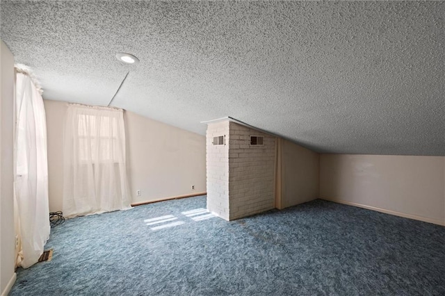 bonus room featuring a textured ceiling, carpet floors, and vaulted ceiling