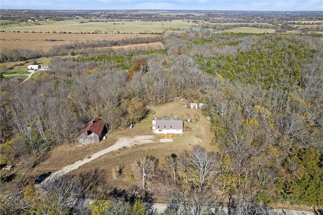 birds eye view of property with a rural view