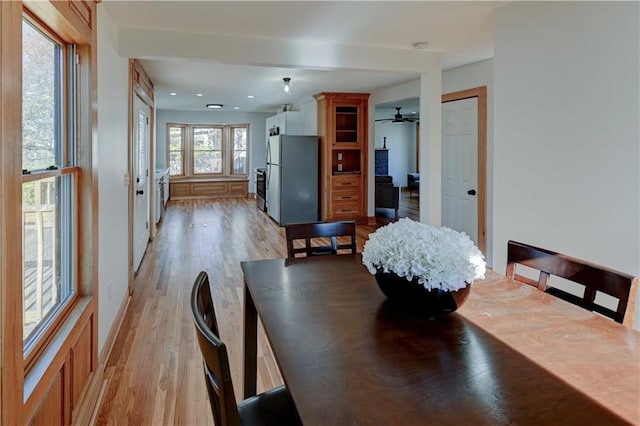 dining room with light wood-style floors and recessed lighting