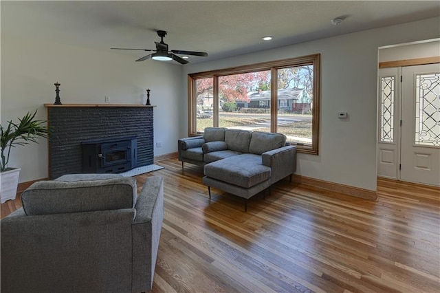 living room with recessed lighting, ceiling fan, baseboards, and wood finished floors