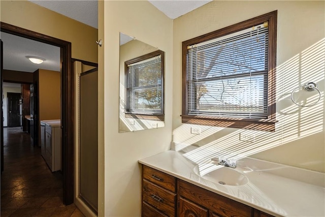 bathroom with vanity and walk in shower