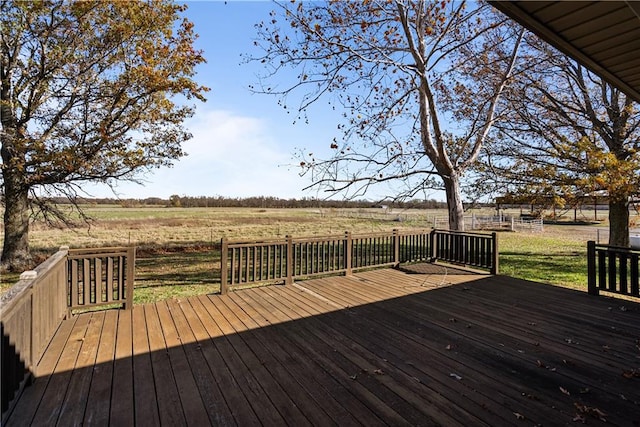 wooden terrace featuring a rural view