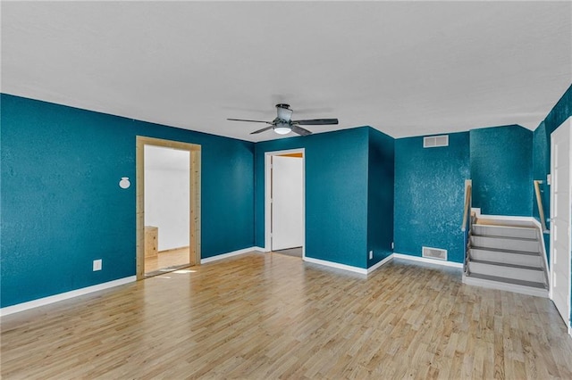 unfurnished living room featuring light hardwood / wood-style flooring and ceiling fan