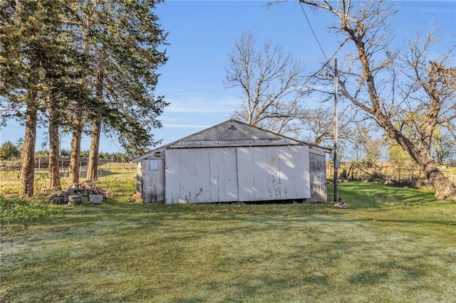 view of outbuilding with a yard