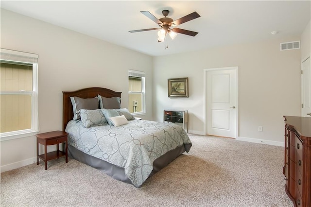 carpeted bedroom with ceiling fan