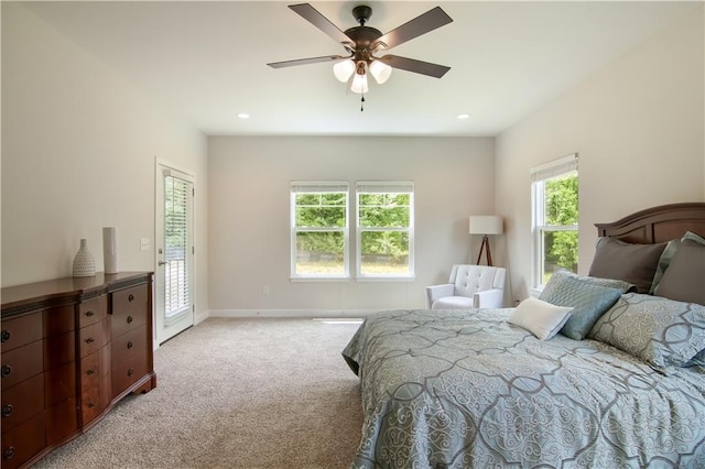 bedroom featuring ceiling fan and light colored carpet