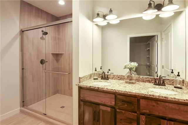 bathroom with vanity and an enclosed shower