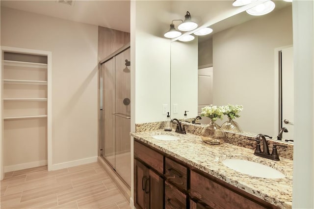 bathroom with vanity and walk in shower