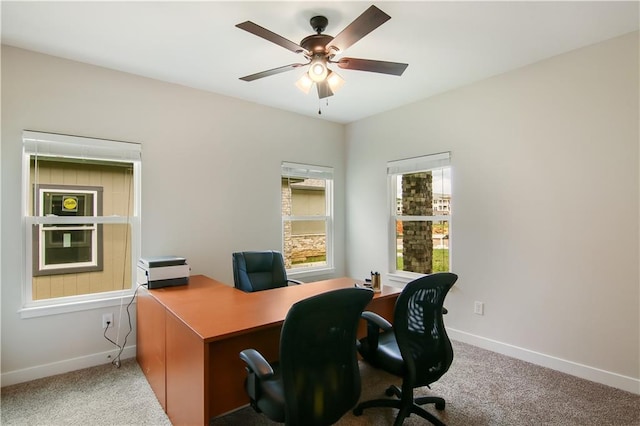 home office featuring carpet floors and ceiling fan