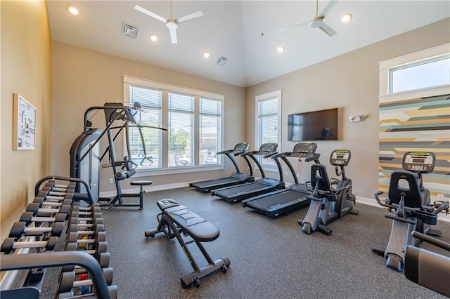 exercise room with ceiling fan, a healthy amount of sunlight, and high vaulted ceiling