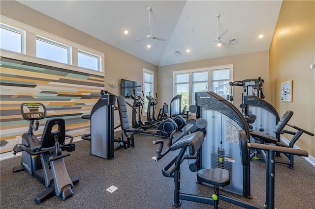 exercise room with ceiling fan and lofted ceiling