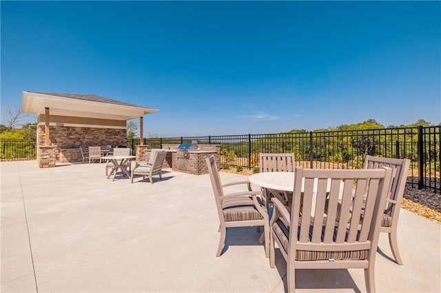 view of patio / terrace featuring exterior kitchen