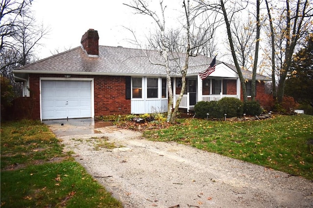 ranch-style house with a front yard and a garage