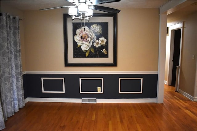 room details featuring wood-type flooring and ceiling fan