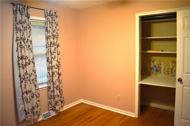 unfurnished bedroom with wood-type flooring