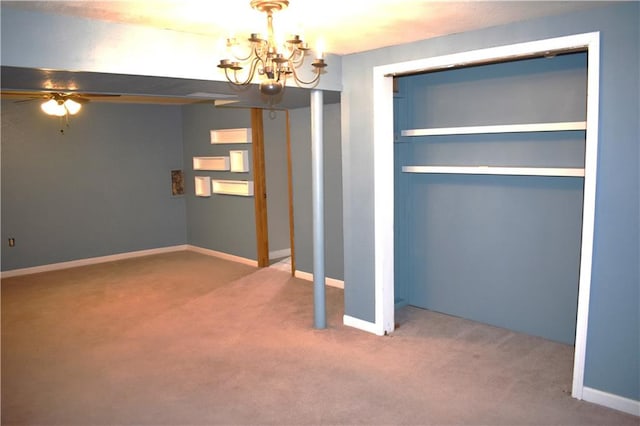 unfurnished bedroom with carpet flooring and an inviting chandelier