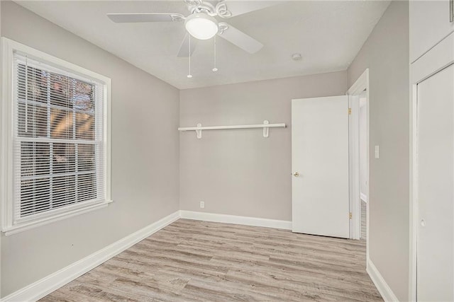 unfurnished bedroom with light wood-type flooring, a closet, and ceiling fan