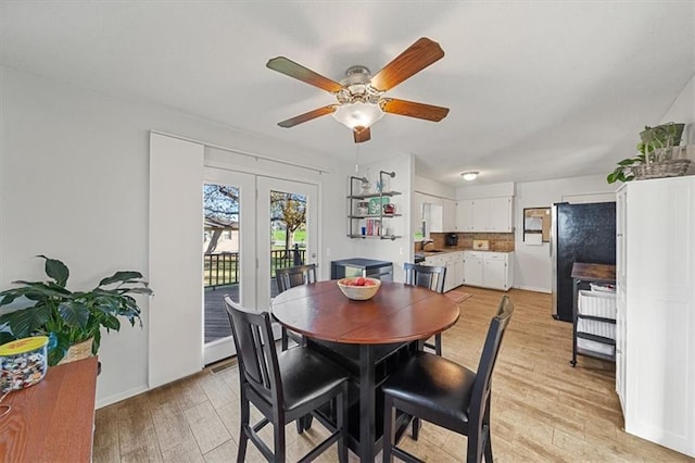 dining space featuring ceiling fan, sink, and light hardwood / wood-style floors