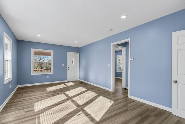 unfurnished room featuring hardwood / wood-style flooring