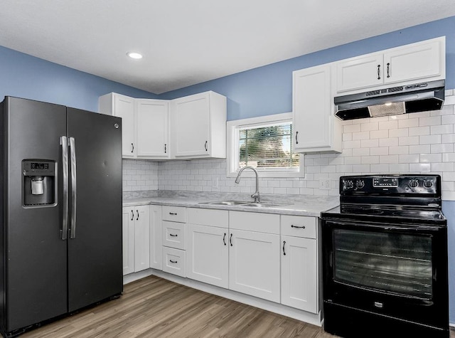 kitchen featuring sink, electric range, light hardwood / wood-style flooring, stainless steel fridge with ice dispenser, and white cabinetry