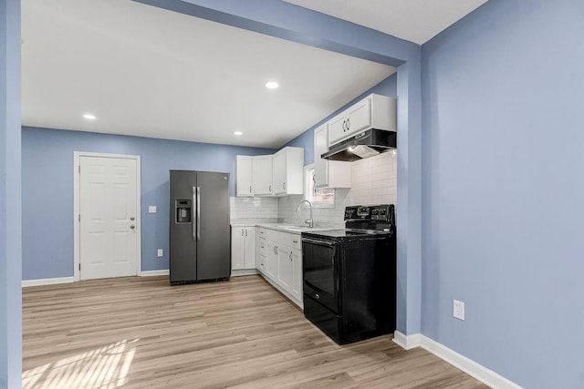 kitchen with white cabinets, stainless steel refrigerator with ice dispenser, black range with electric stovetop, and extractor fan