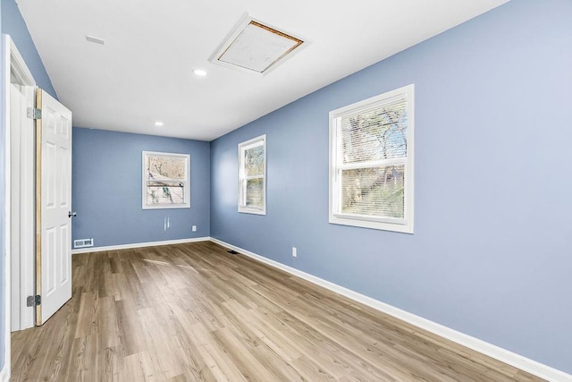 spare room with light wood-type flooring