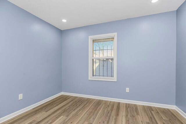 spare room with light wood-type flooring