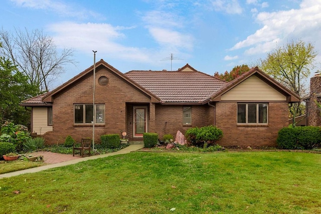 ranch-style home with a front yard