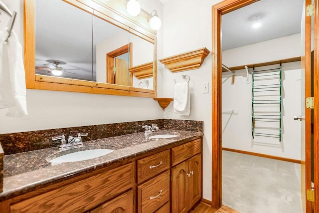 bathroom featuring vanity and ceiling fan