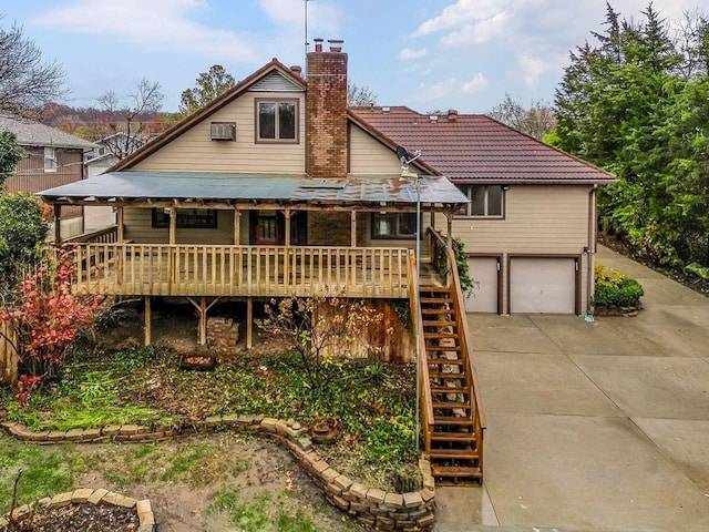 back of house with a garage