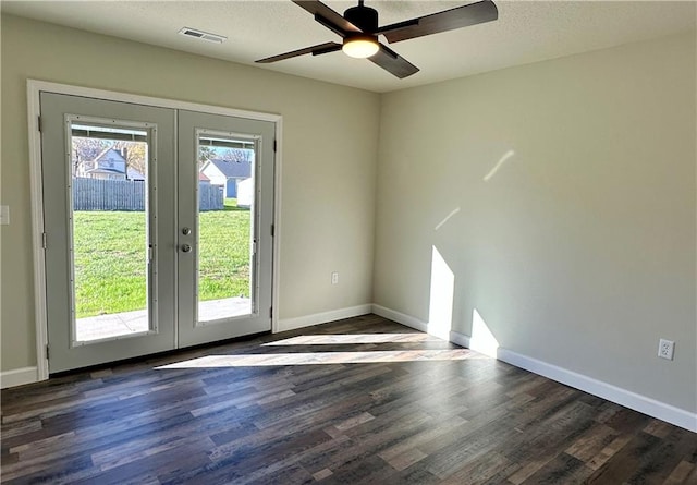 entryway featuring a textured ceiling, ceiling fan, dark wood-type flooring, and french doors