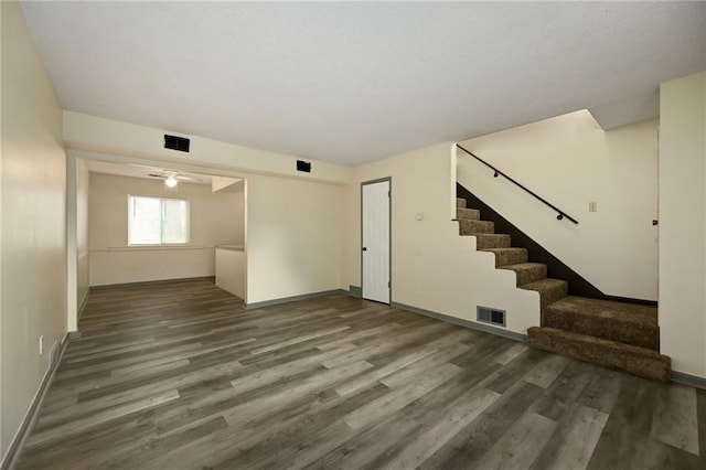 interior space featuring hardwood / wood-style floors and ceiling fan