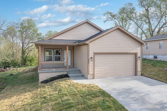 view of front of house with a front yard, a porch, and a garage