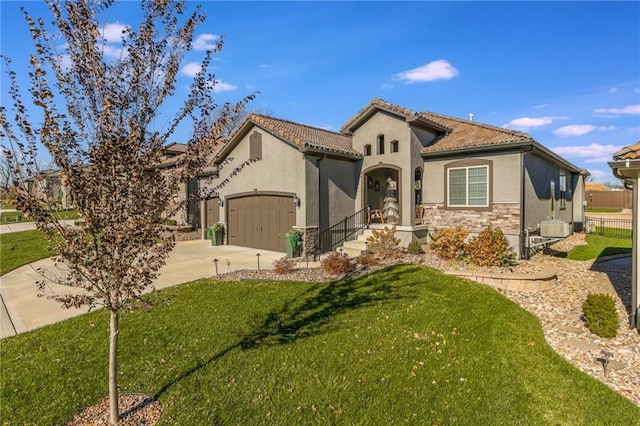 mediterranean / spanish-style home featuring a garage and a front lawn