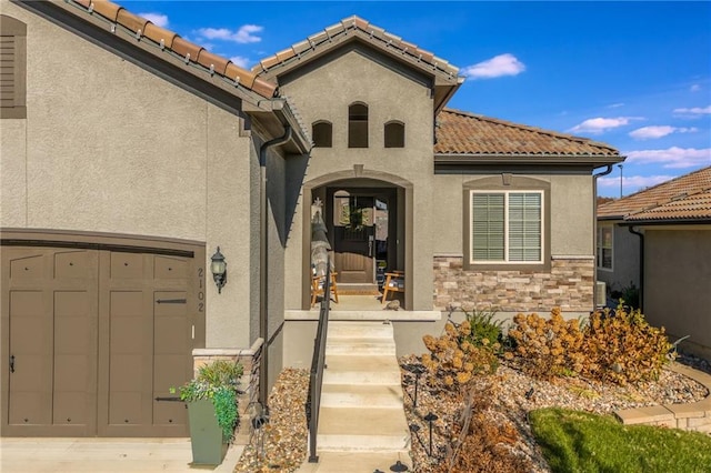 view of exterior entry featuring a garage