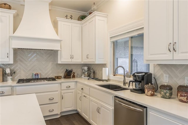 kitchen with white cabinets, stainless steel appliances, and custom exhaust hood