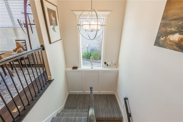 entryway featuring an inviting chandelier