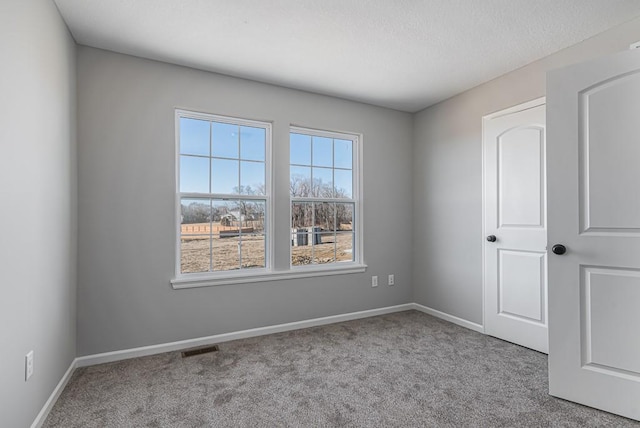 empty room featuring light colored carpet