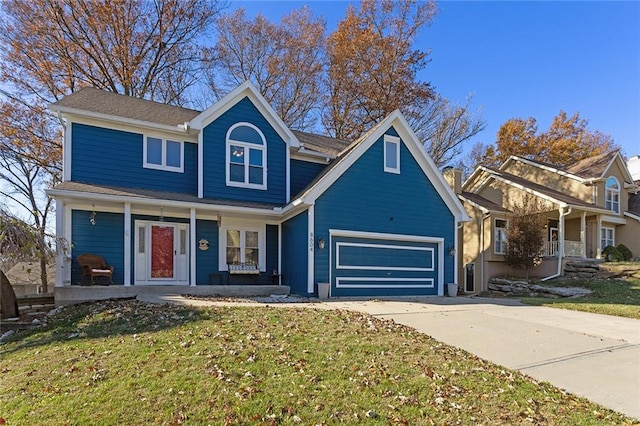 view of front of house with a porch, a front yard, and a garage