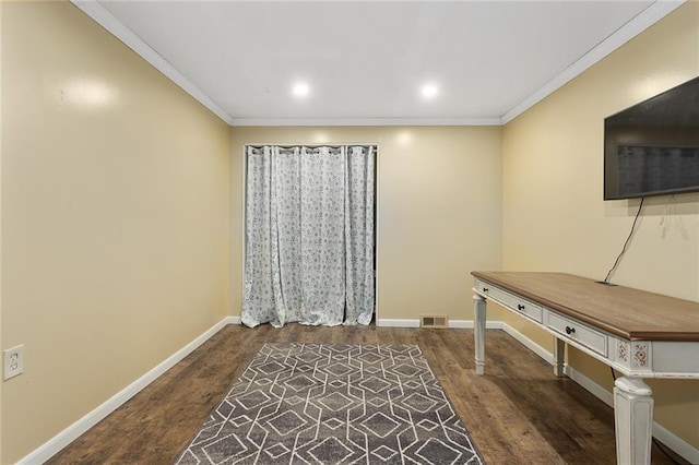 misc room with dark wood-type flooring and ornamental molding