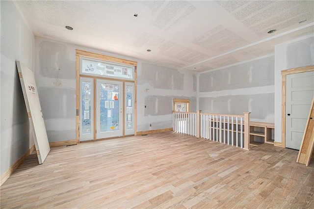 unfurnished living room featuring light wood-type flooring