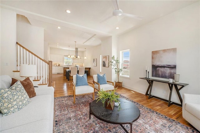 living room featuring stairway, wood finished floors, and recessed lighting