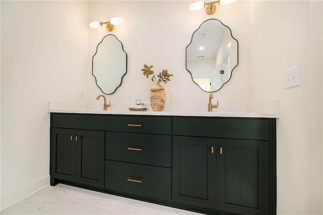 full bathroom featuring double vanity, marble finish floor, and baseboards