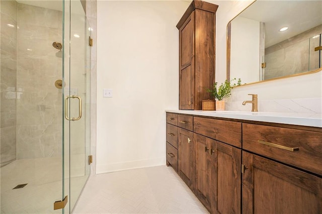 full bath featuring vanity, recessed lighting, a stall shower, and baseboards