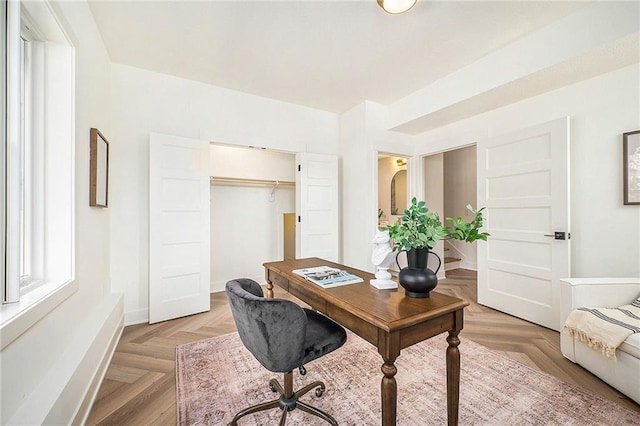 office space with baseboards