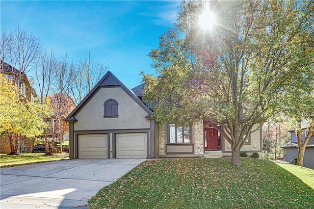 view of front facade with a garage and a front lawn