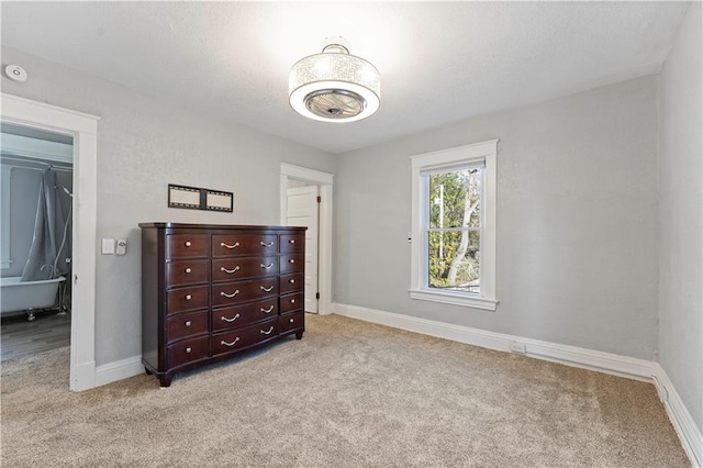 bedroom featuring light carpet