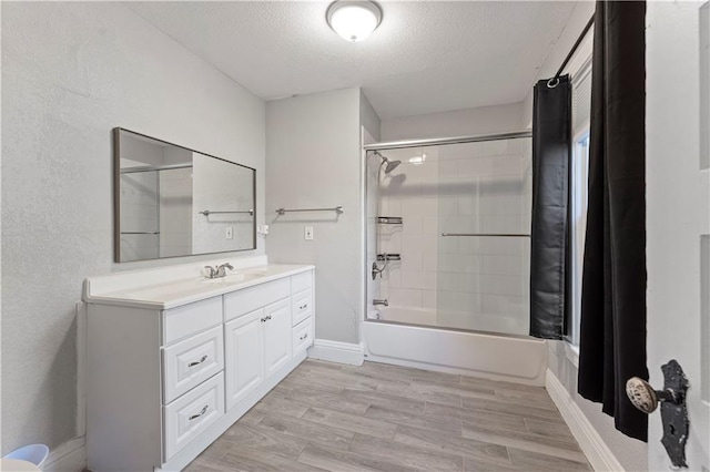 bathroom featuring vanity, shower / tub combo, a textured ceiling, and hardwood / wood-style flooring