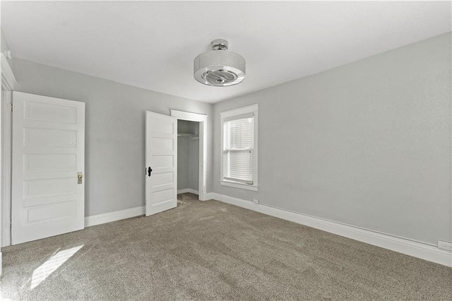 unfurnished bedroom featuring a closet and carpet floors